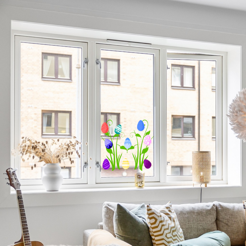 Osterdeko Fensterbild. Selbsthaftende bunte Ostereier und Rankepflanze zum Anbringen auf das Fenster oder andere glatten Oberflächen