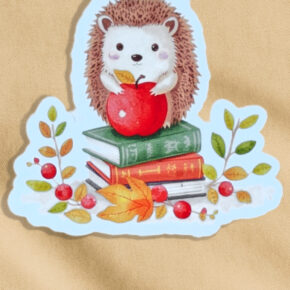 Magnetisches Lesezeichen mit Igel und Apfelkorb im Aquarellstil.